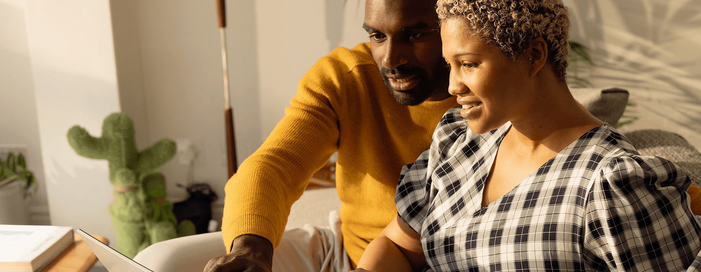 Image of a couple looking at a computer screen